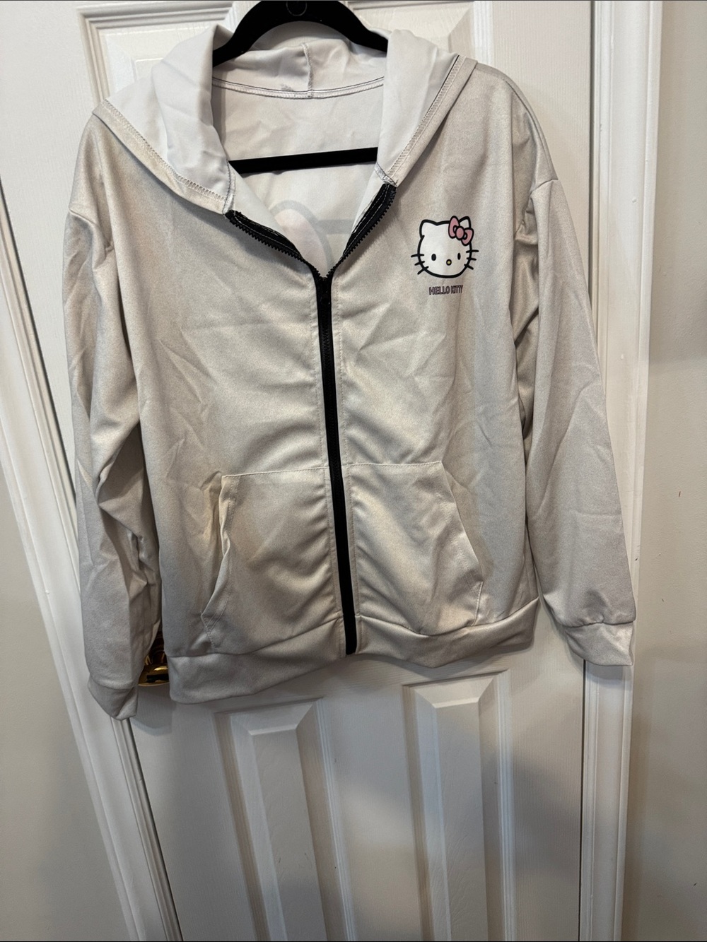 Women’s Hello Kitty Light Silver Zip Hoodie with Pink Bow Detail